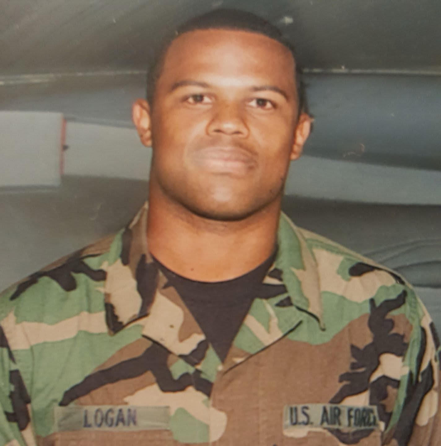 Man in U.S. Air Force unform looks at camera