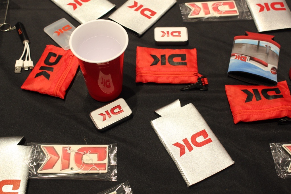 Giveaway items scattered on a table at an ACU basketball game for anyone in the community.