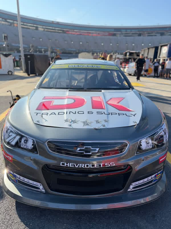 Race car with DK Fuel on the hood.